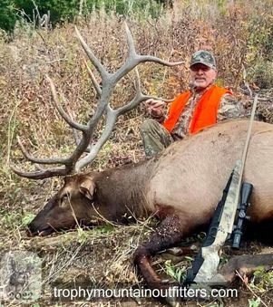 Hunter in Western Wyoming with trophy bull elk